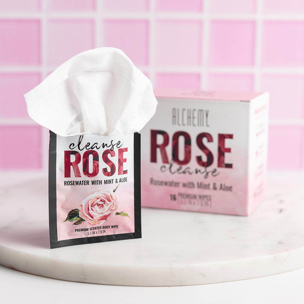 Alchemy Cleanse Rosewater Scented Wipes on marble surface with light pink tile background