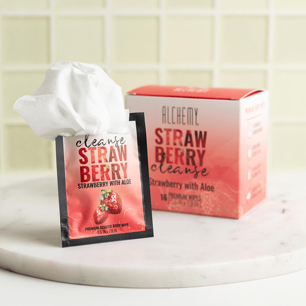Alchemy Cleanse Strawberry Scented Wipes on marble surface with yellow tile background