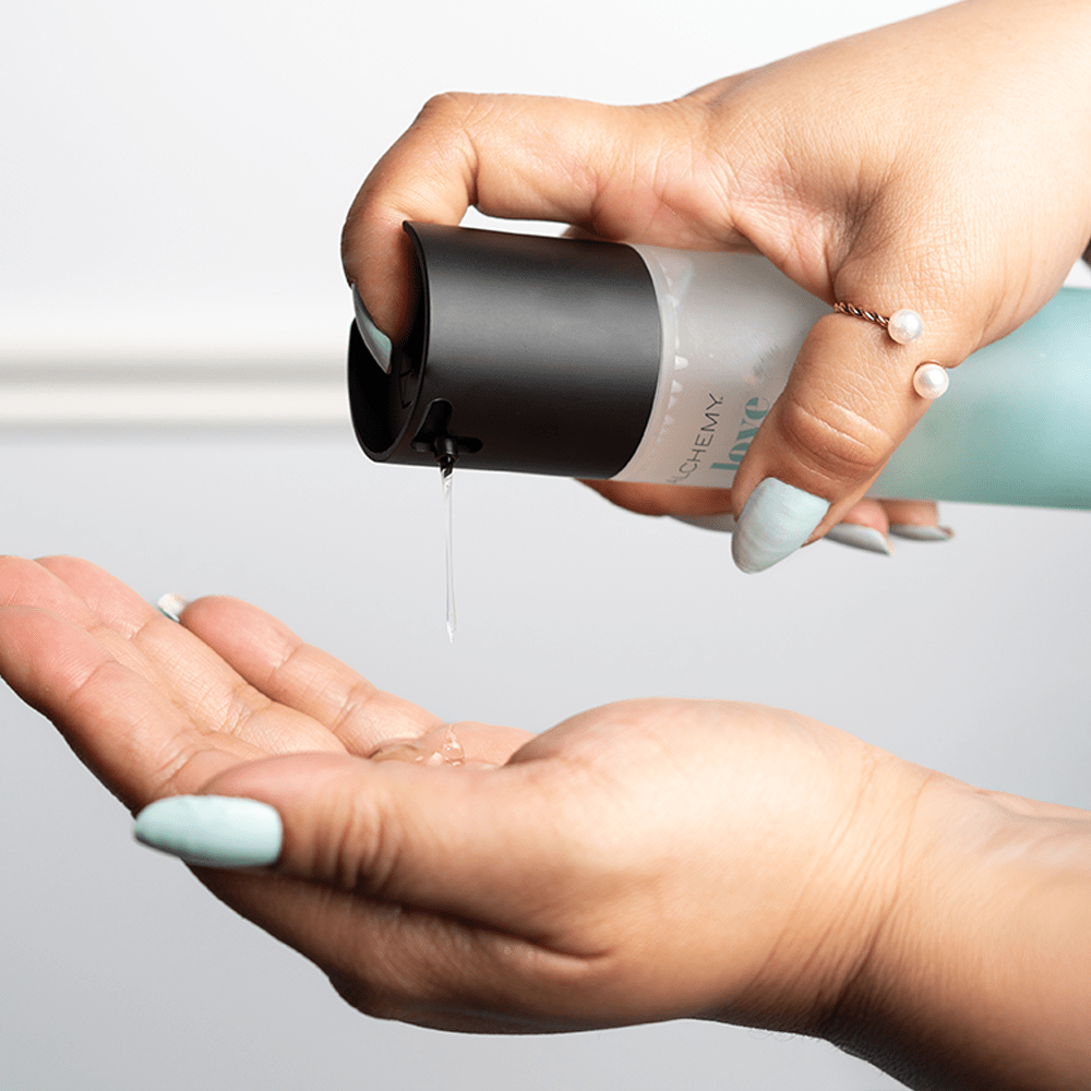 Alchemy Love Water: Water-Based Personal Lubricant in woman's hand