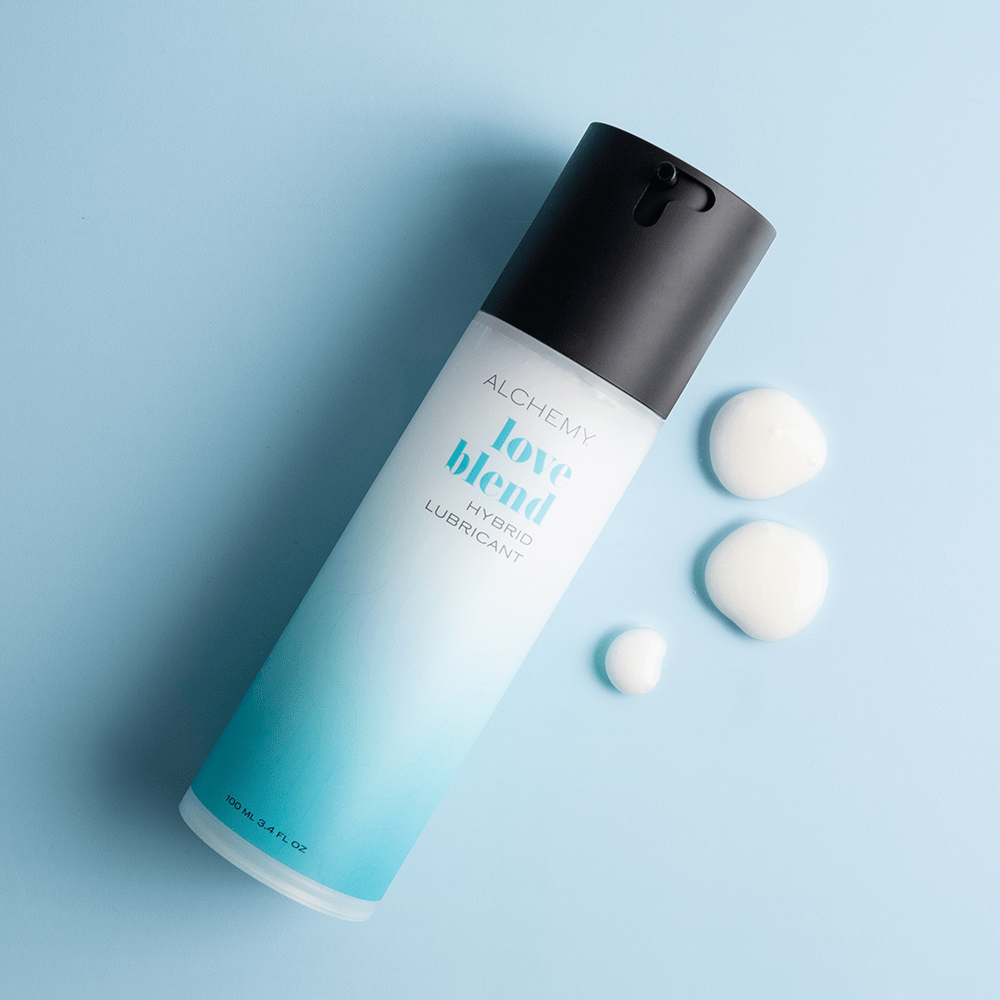 Alchemy Love Blend: Hybrid Personal Lubricant bottle with liquid droplets