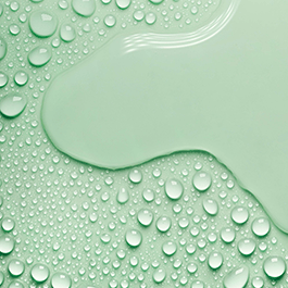 Alchemy Aloe: Hydrating Water-Based Personal Lubricant – close-up of water droplets on green background
