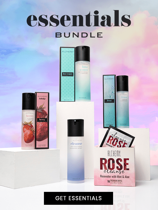 Alchemy personal lubricant bottles and boxes with a colorful gradient background and 'essentials bundle' text.