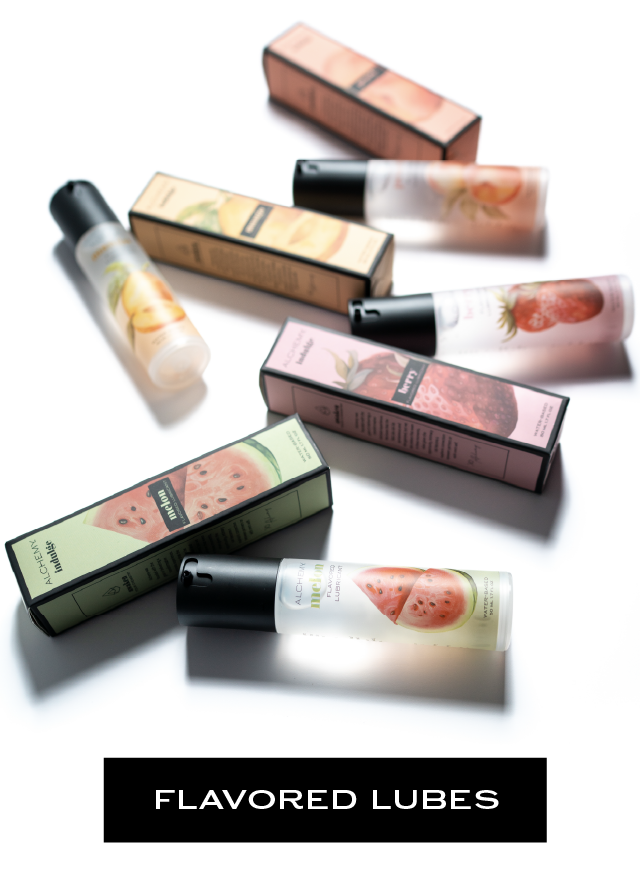 Alchemy Flavored Lubes: Photo of bottles of luxury personal lubricant and their boxes on a white studio background