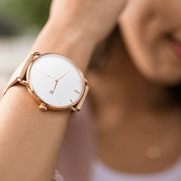 Alchemy Love Blend: Hybrid Personal Lubricant – long-lasting: close-up of a woman's wrist watch