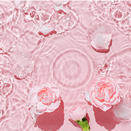 Alchemy Rosebud: Luxury Air-Pulse Massager – water ripples with roses and pink background