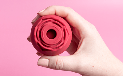 Alchemy Rosebud: Luxury Air-Pulse Massager in woman's hand