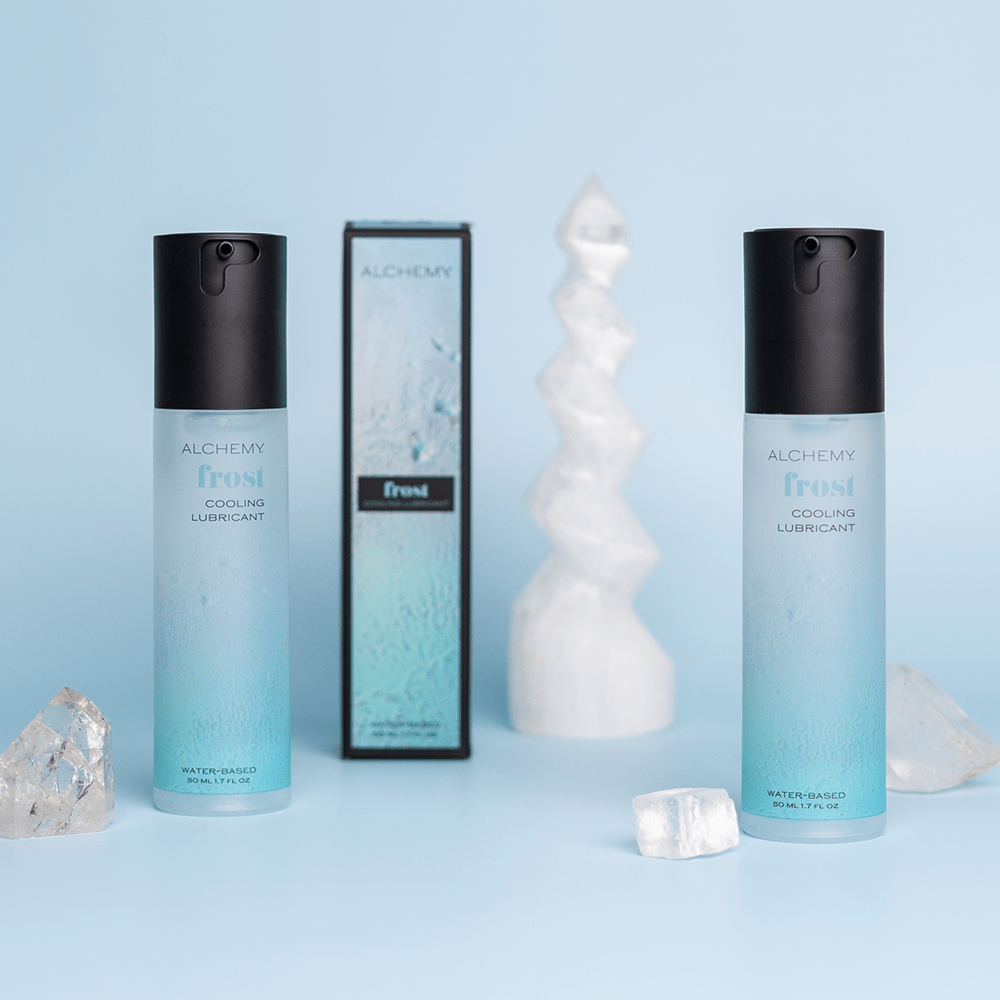 Alchemy Frost: Water-Based Cooling Personal Lubricant bottles and box with crystals and blue background