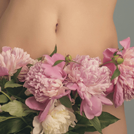 Body loving: close-up of woman's torso with flowers