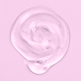Lubricant top view on a pink background showing texture and viscosity