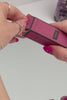 Alchemy Spark Female Arousal Gel: woman's hands opening box and showing squeeze bottle